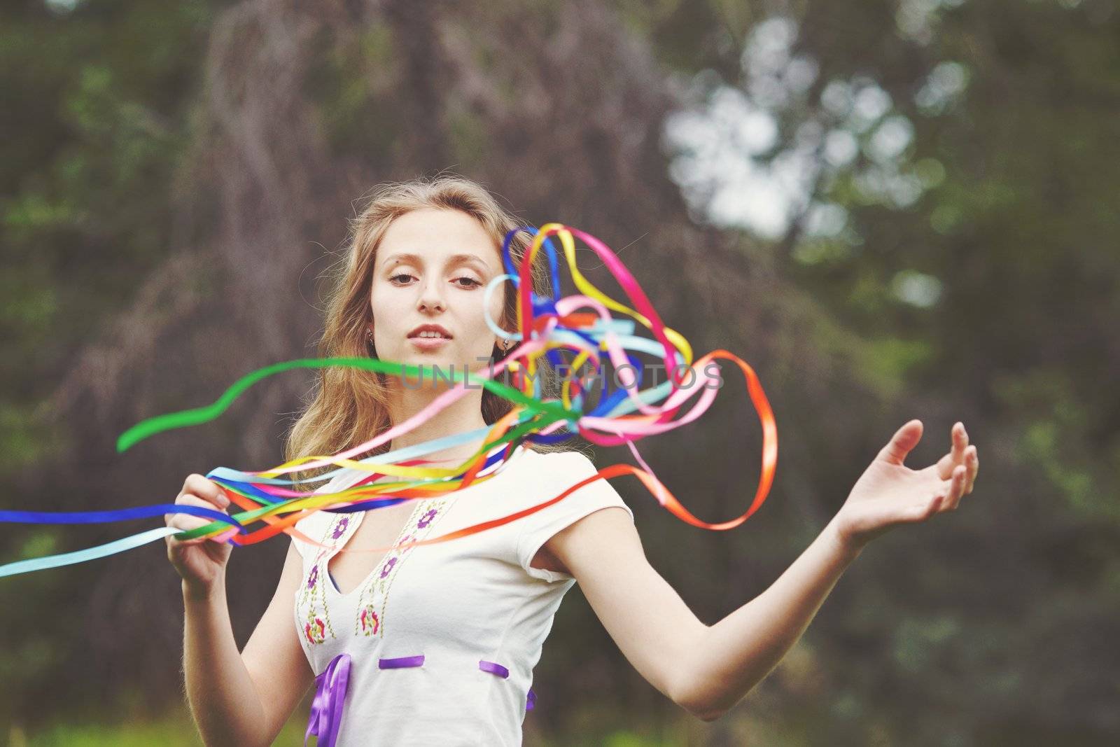 Beautiful girl with ribbons. Early morning photo