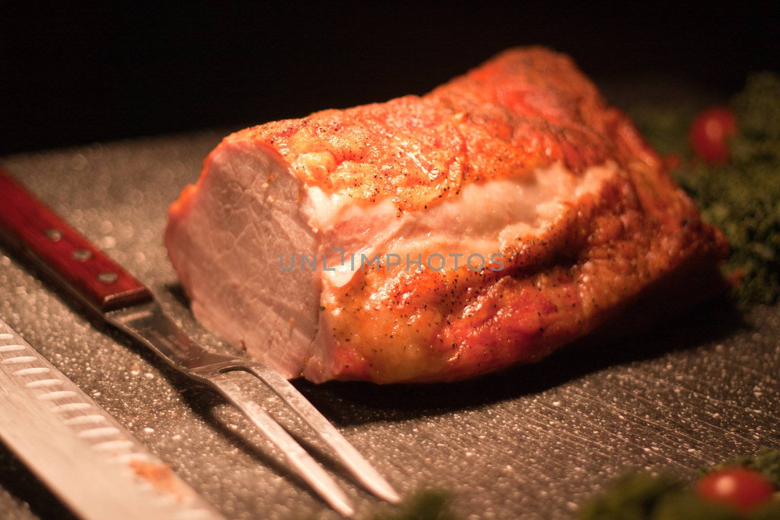 pork roast on carving station with decoration