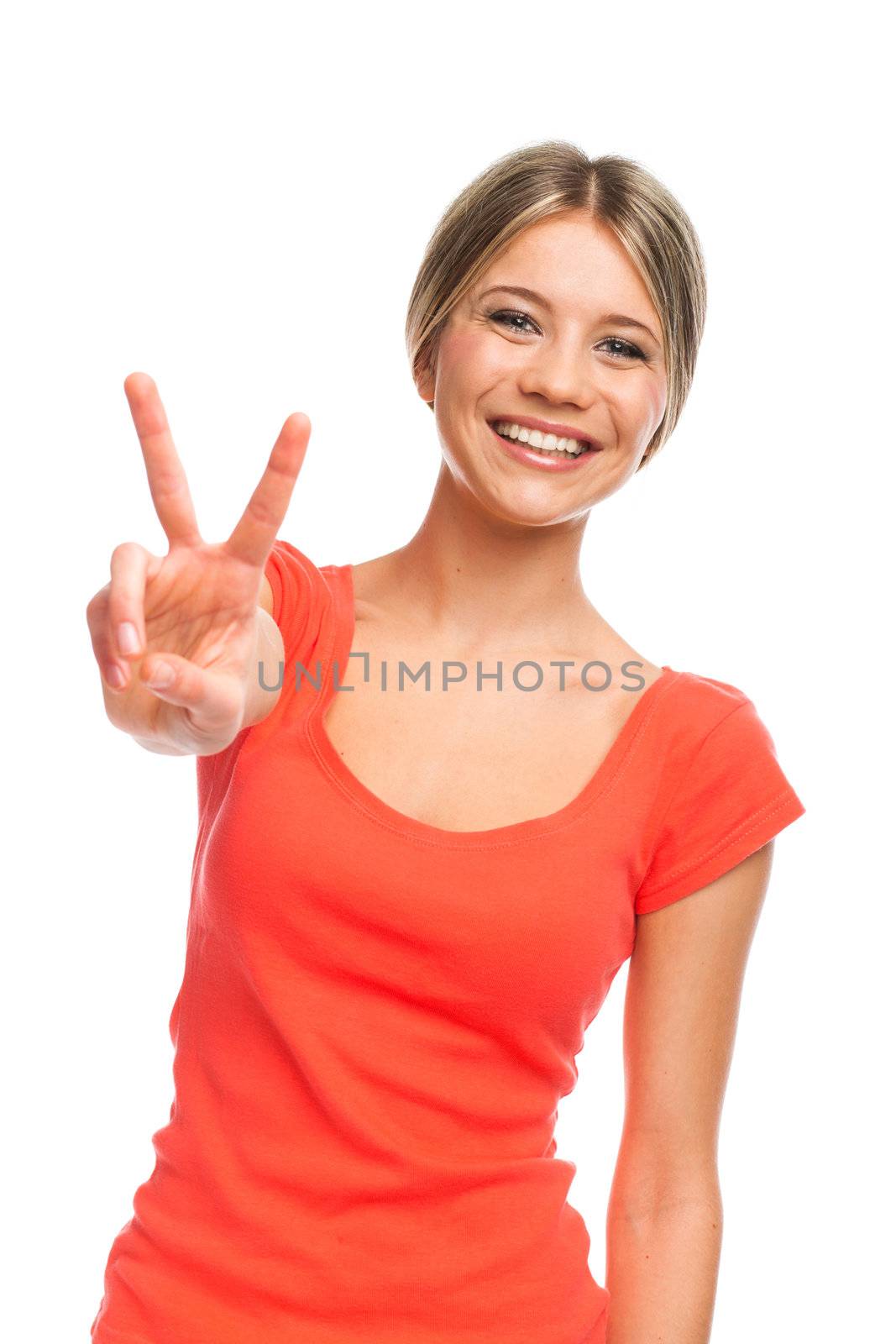 Young woman showing two fingers, positive or peace gesture, on white