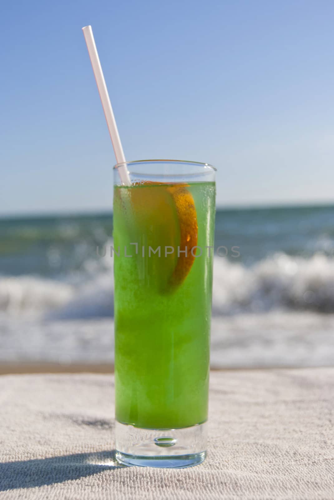 Green cocktail on the beach