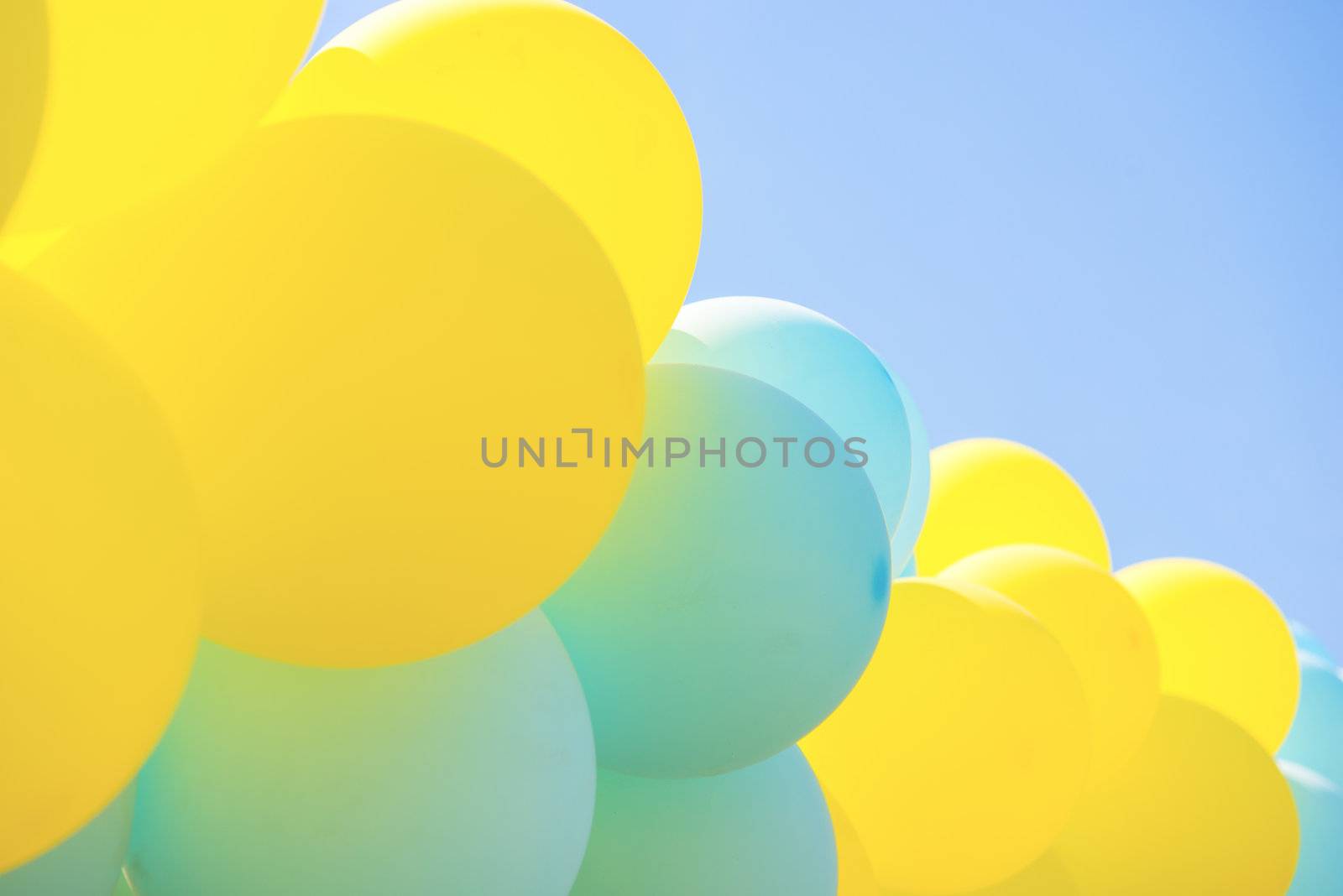 Balloons on a background blue sky .