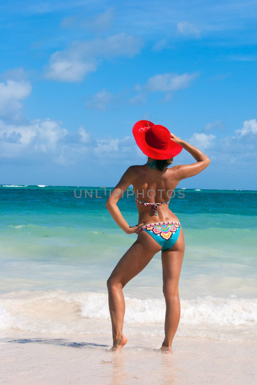 Sexy beaytiful woman in bikini posing on the caribbean beach