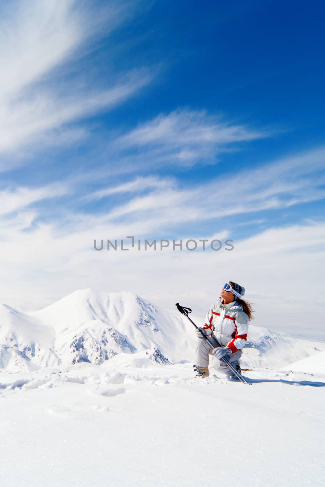 Beautiful skier on the top of mountain  by Denovyi