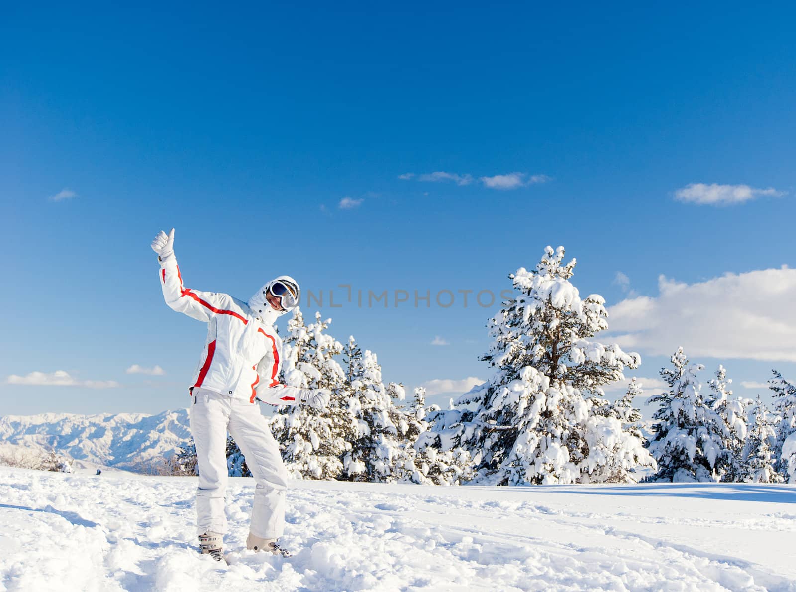 Happy skier on the top of mountain by Denovyi