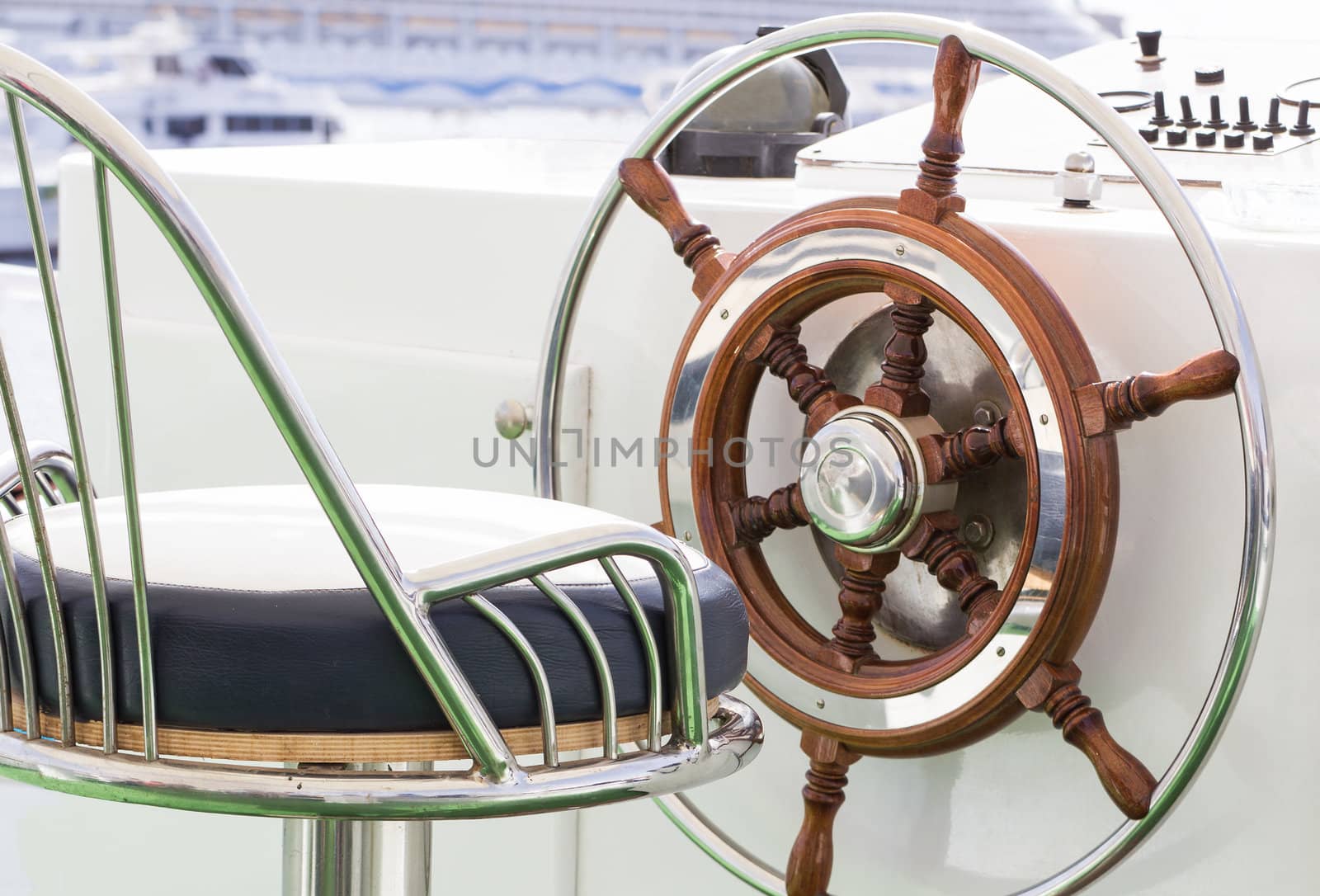 Closeup of rudder and chair in a luxury boat.