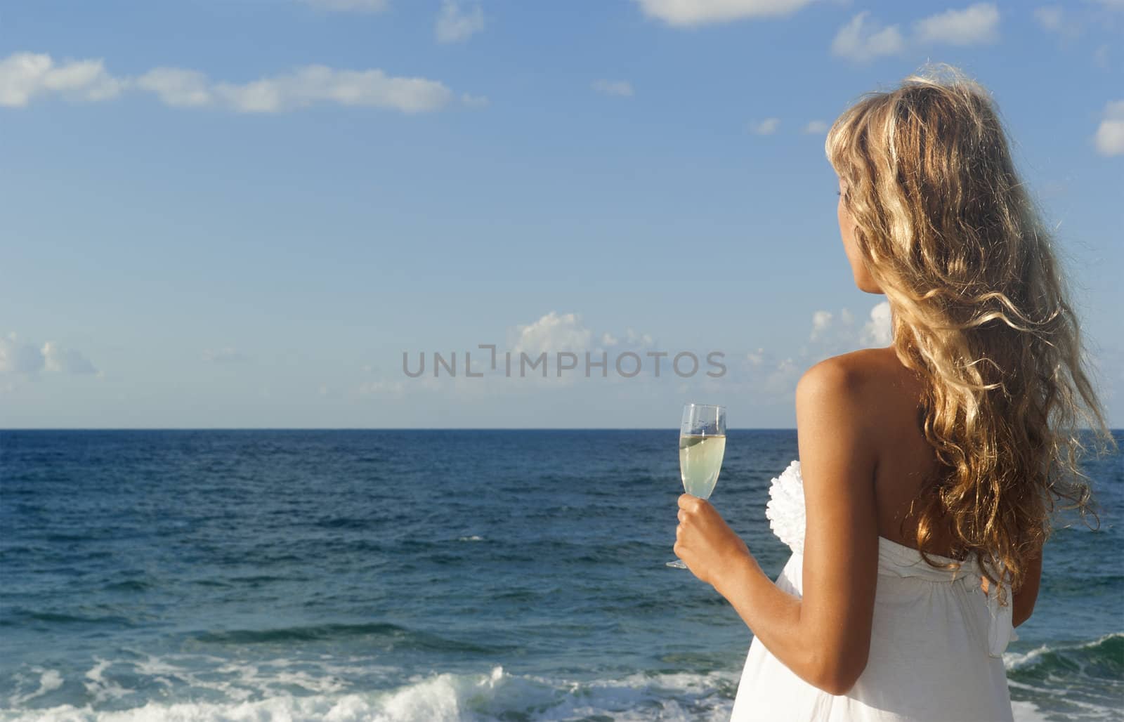 Beautiful woman looking at the sea by Denovyi