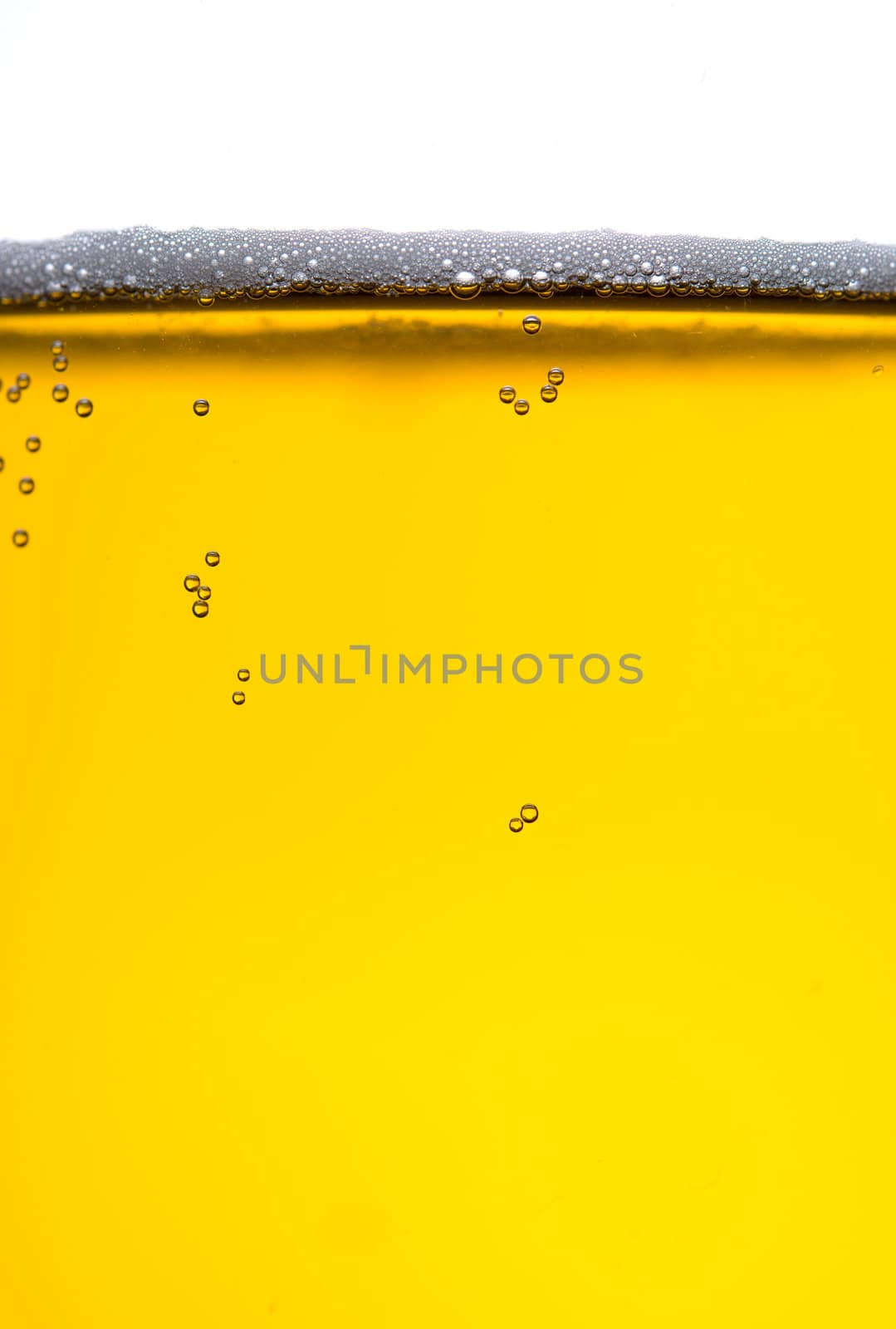 Fresh beer with froth and condensed water pearls