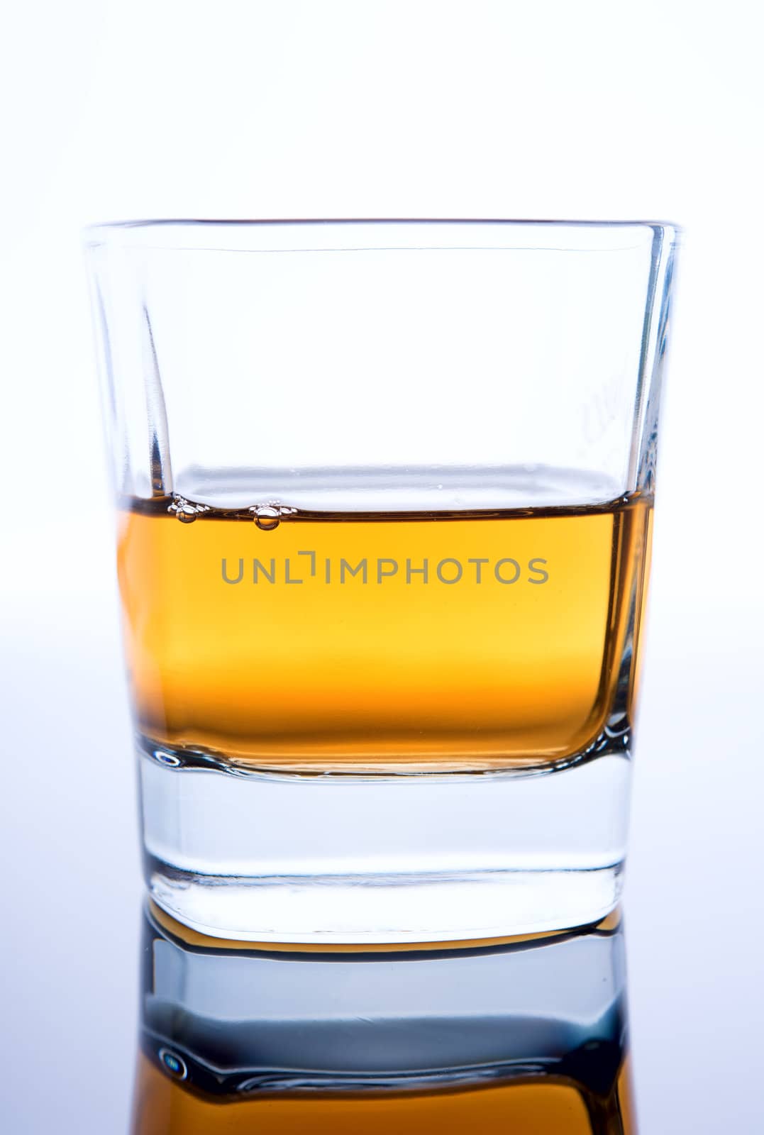 glass of cognac on a white background