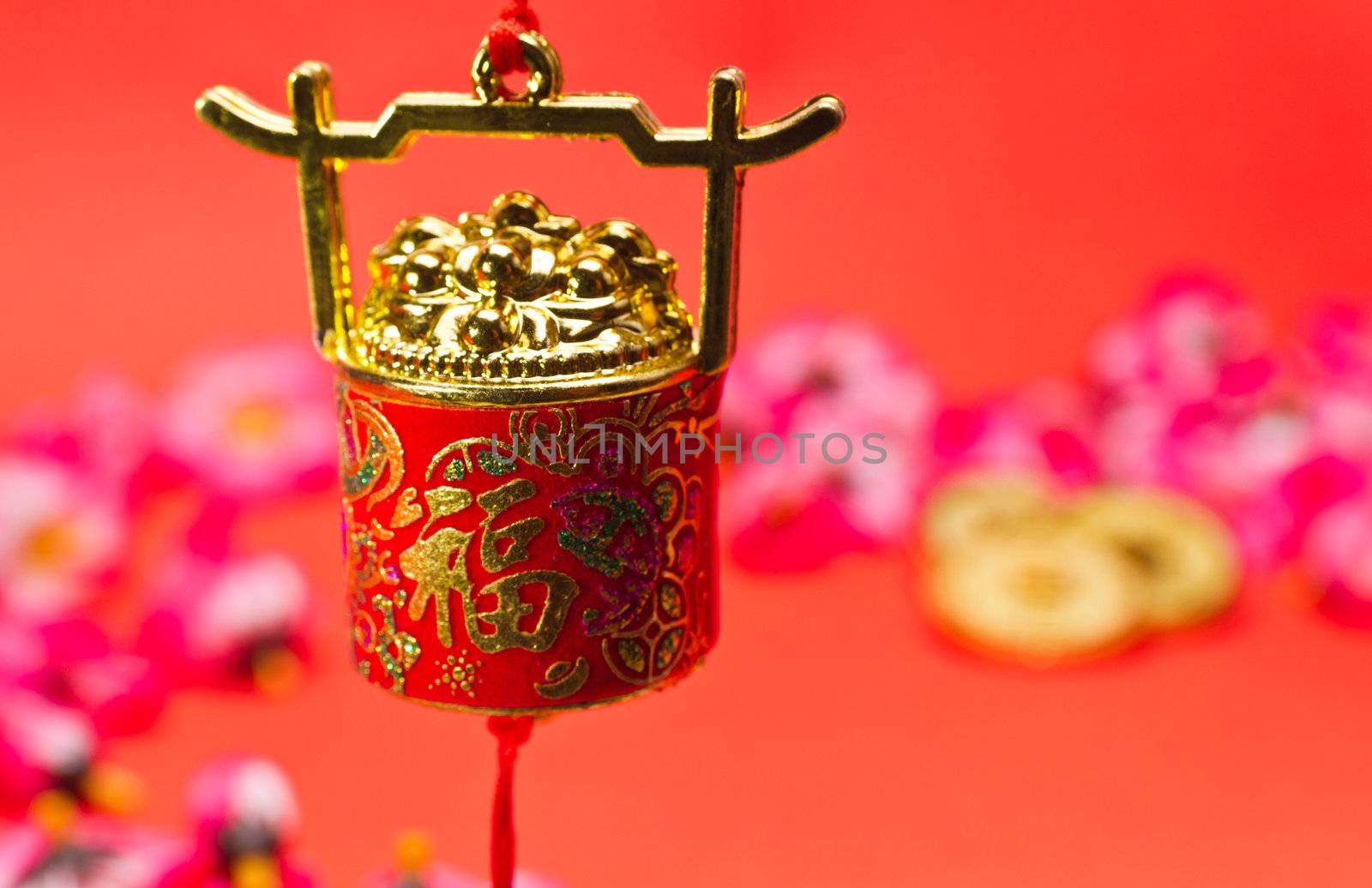 Chinese New Year ornament on red background with blurry image for festive using
