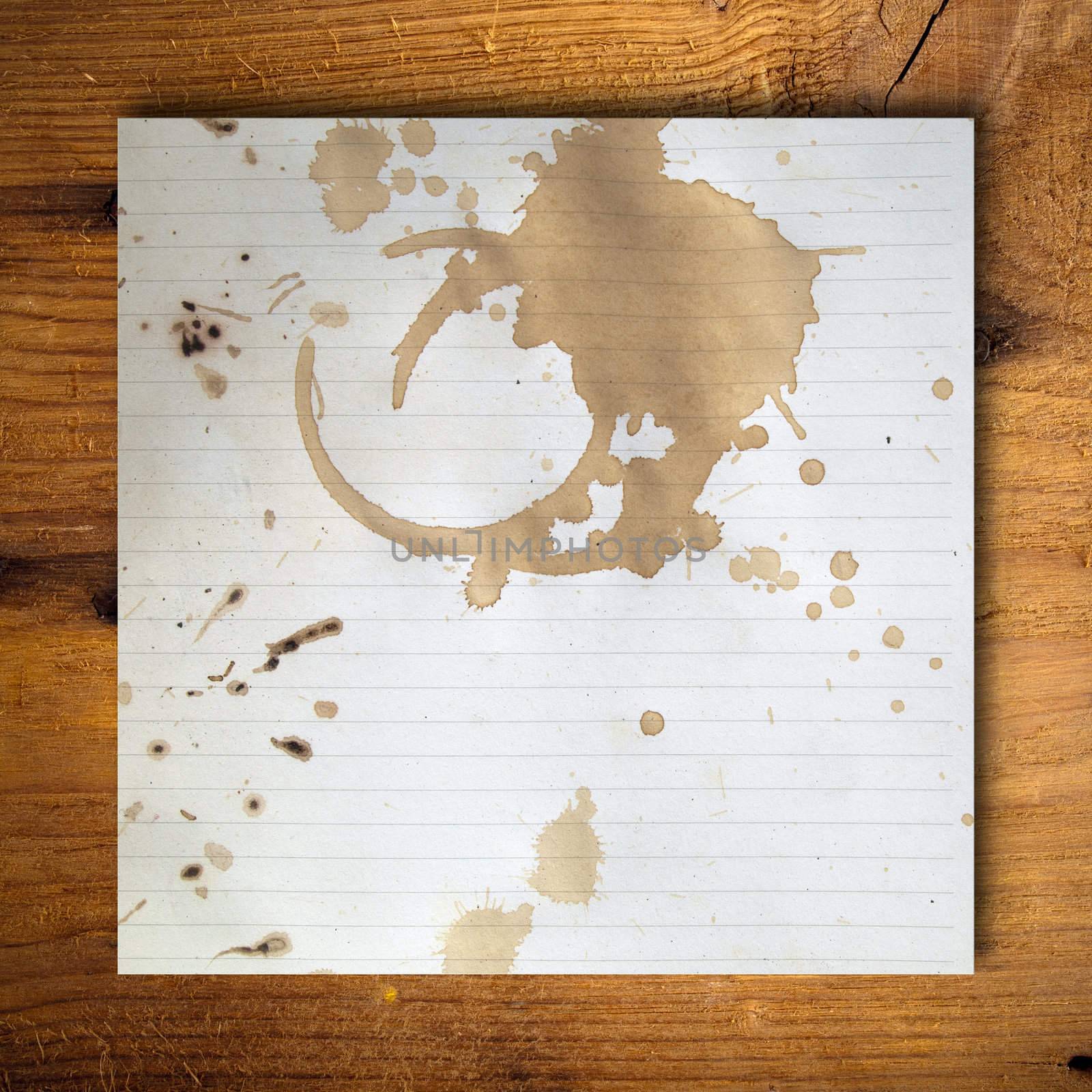 Coffee stains on blank white paper by nuttakit