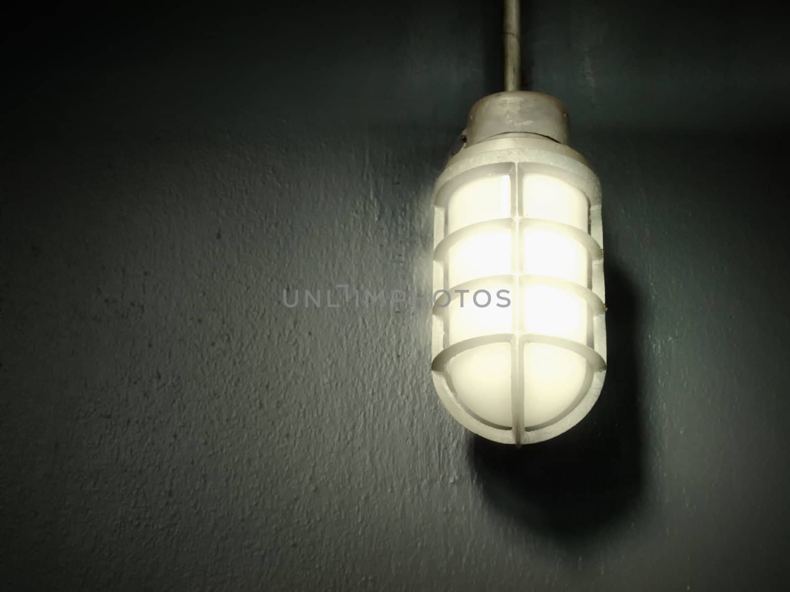 Open bright light steel gray lamp on the wall