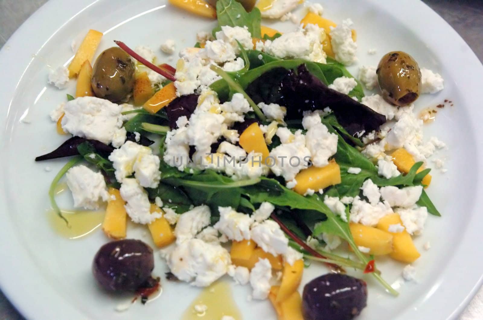 feta Nectarine Olive Salad on white plate