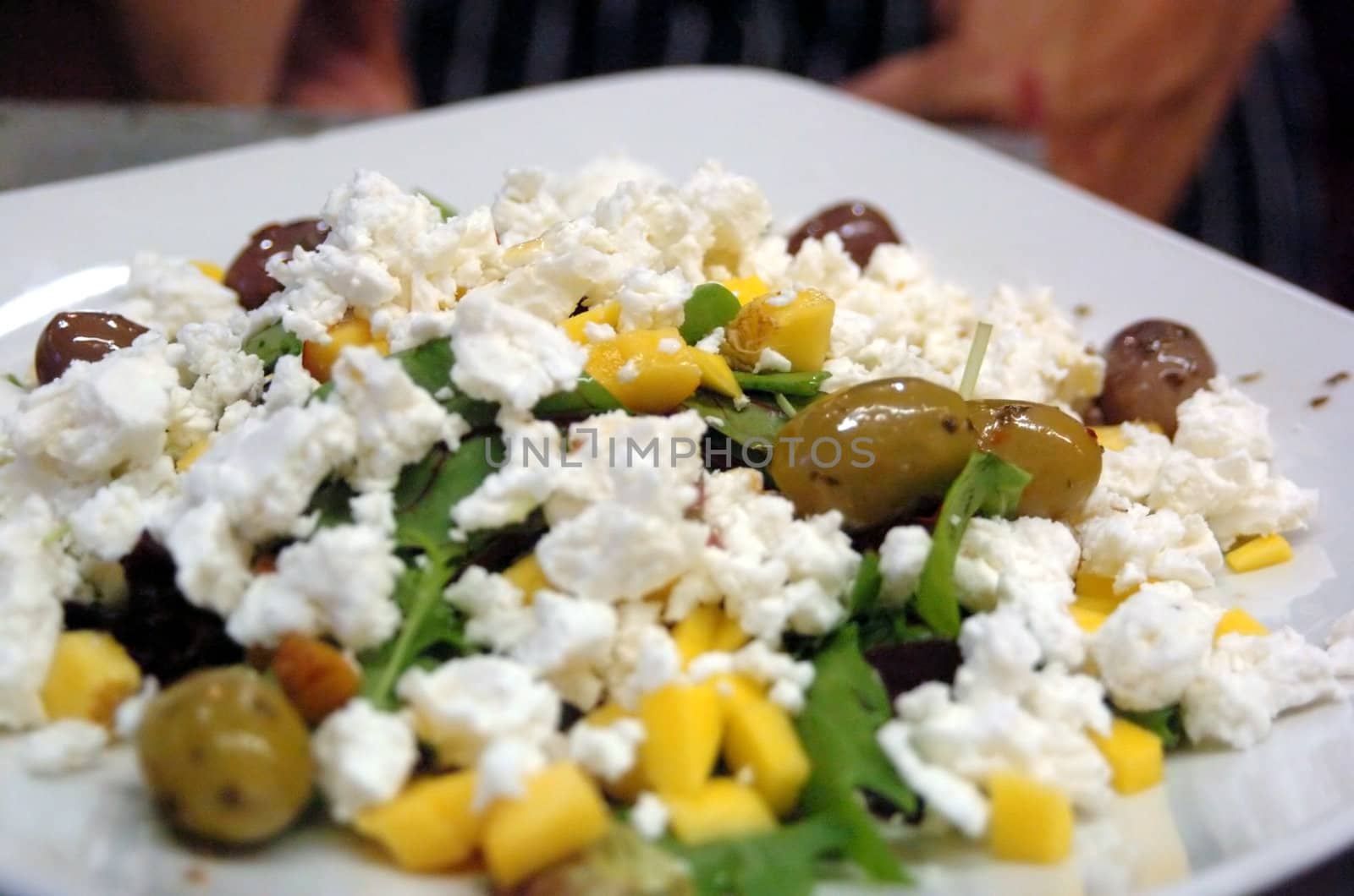 feta Nectarine Olive Salad on white plate