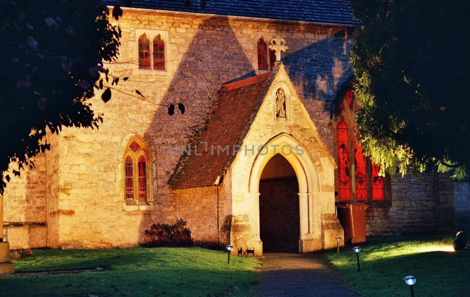 entry of old english country church by night