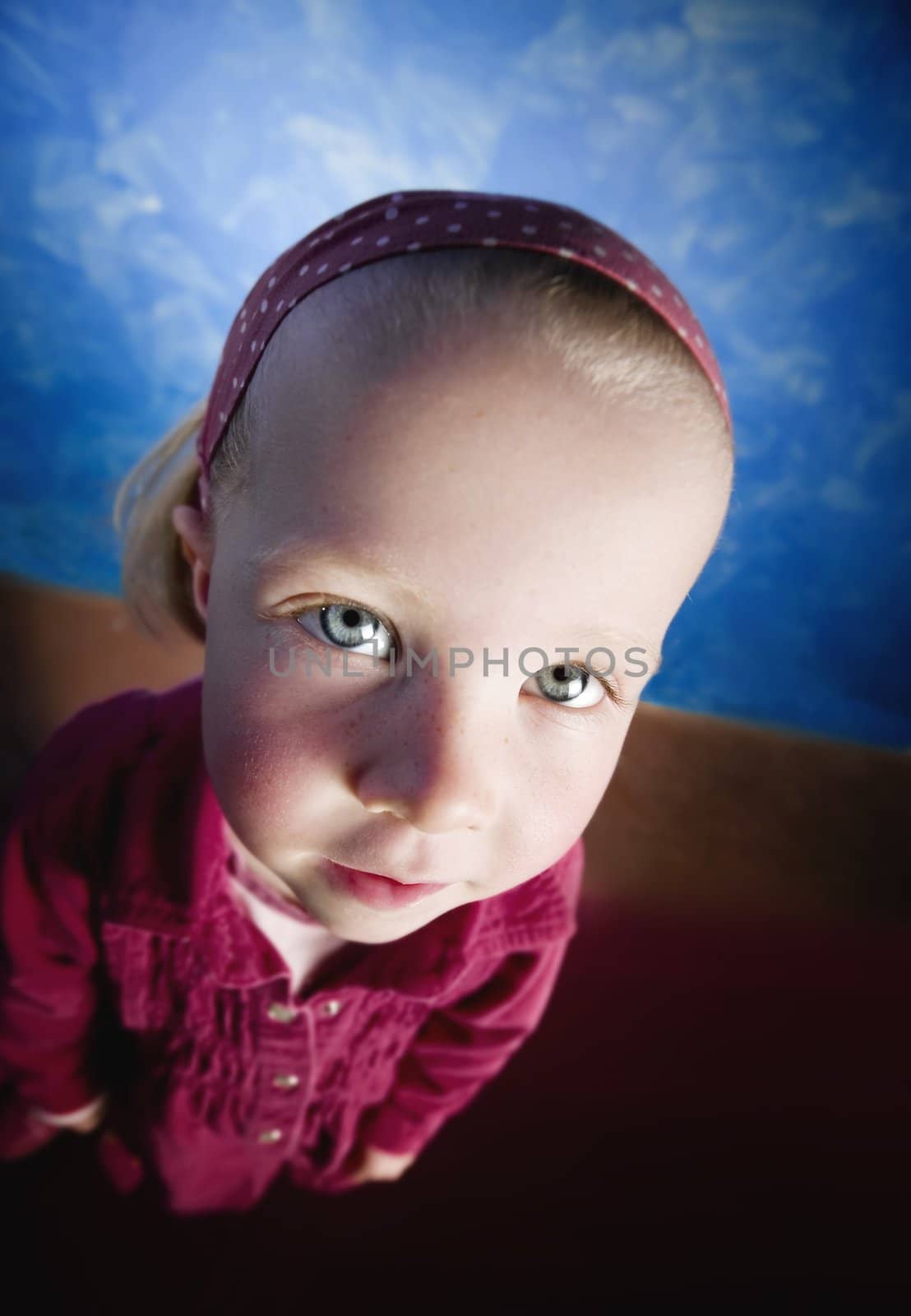 Little girl's face distorted in a wide angle lens shot