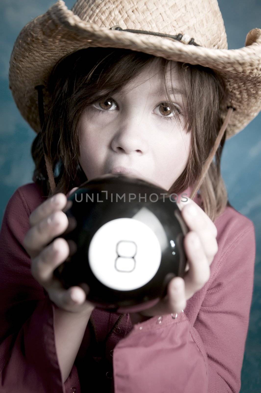 Little girl learns her future from a toy 8 ball