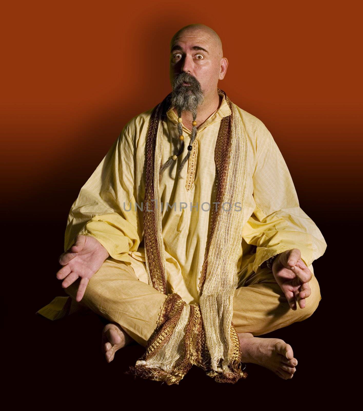 Funny guru sitting lotus style.