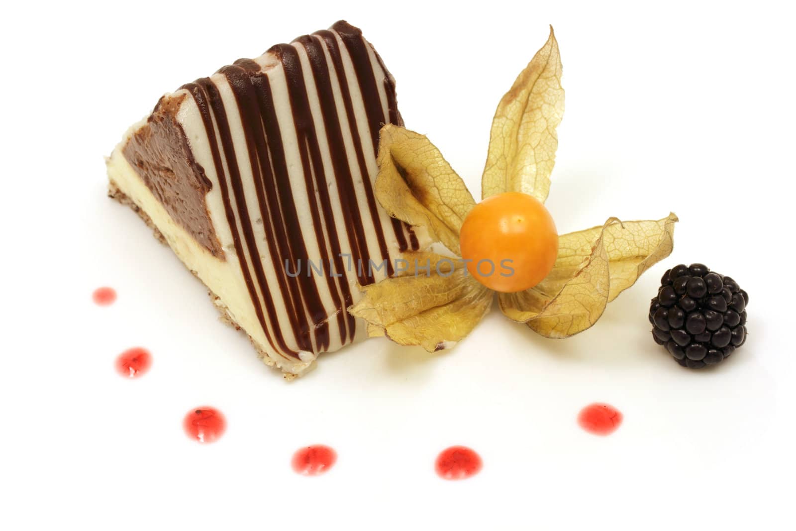 Chocolate triangle cake decorated with ground cherry on white background