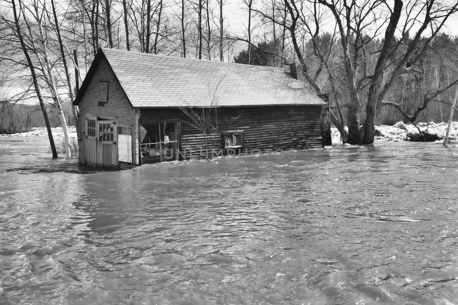 old barn during a flood,shown in black and white