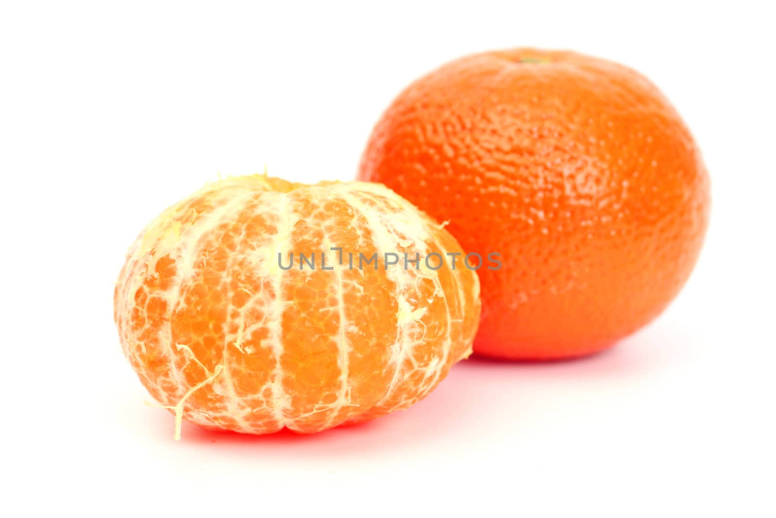 Two tangerines isolated over white background