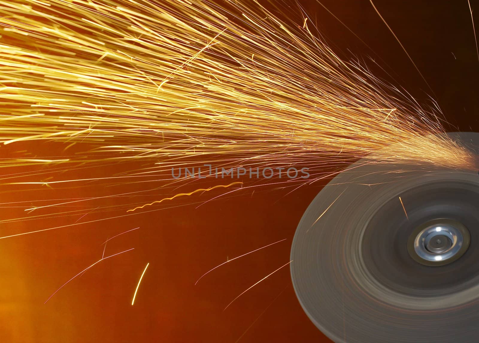 a close up picture of sparks on a grinding wheel