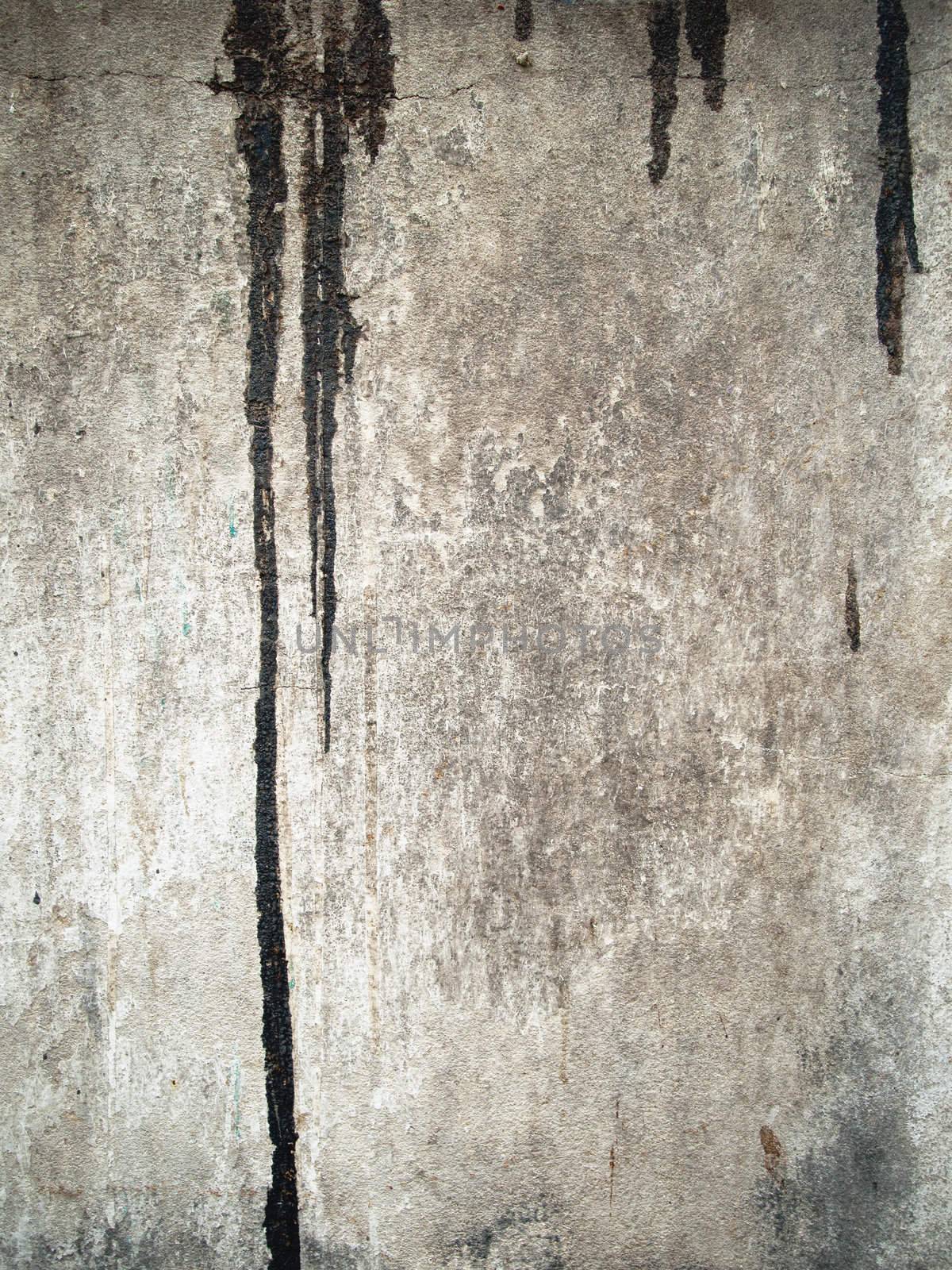 Texture of dirty black color drop on grunge old wall vertical