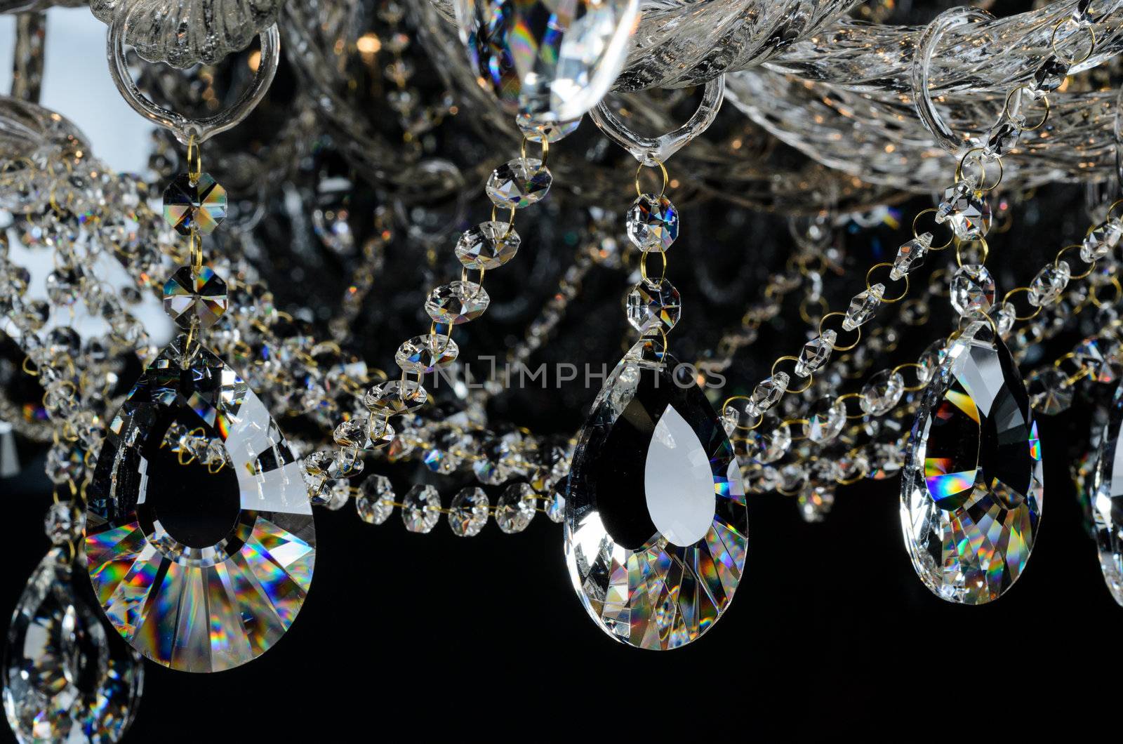 Contemporary glass chandelier isolated over black background