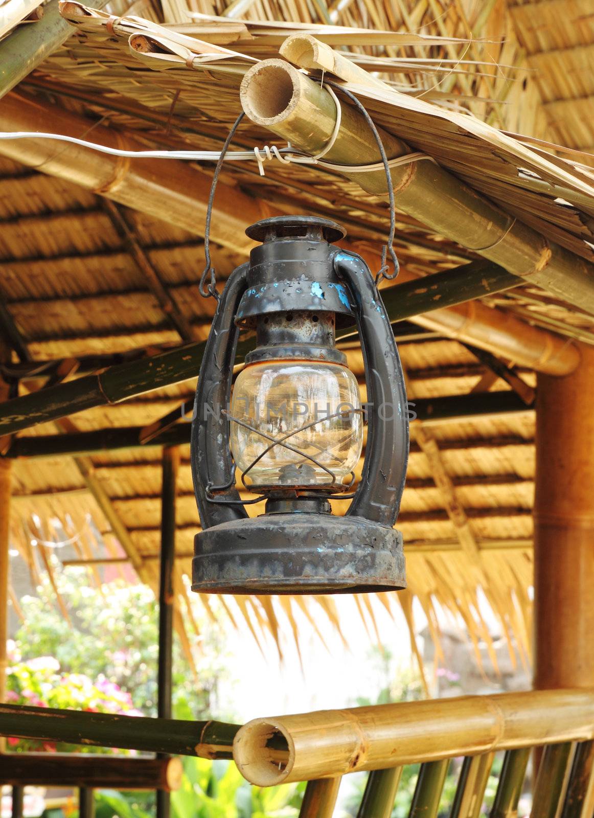 ancient lamp with wooden cottage