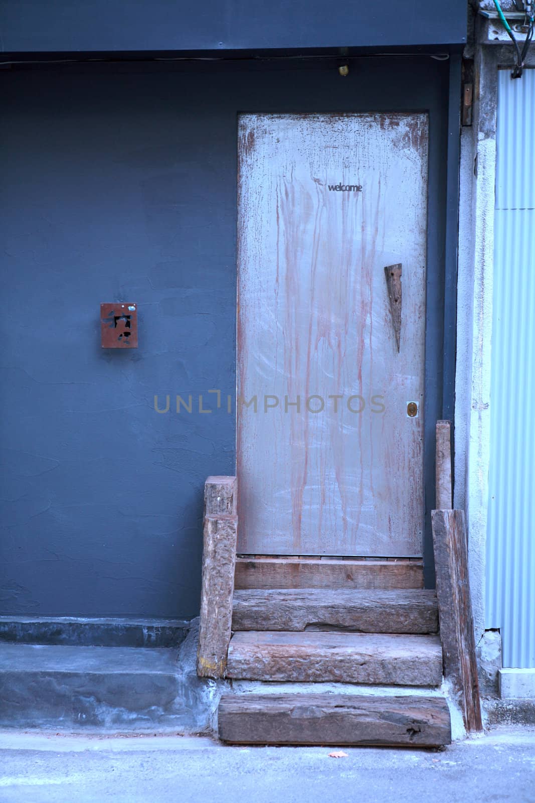 Closed blue door, part of a home and building