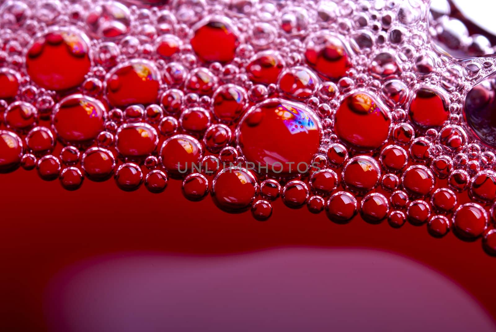Bubbles of red wine from the different foreshortening  in glass