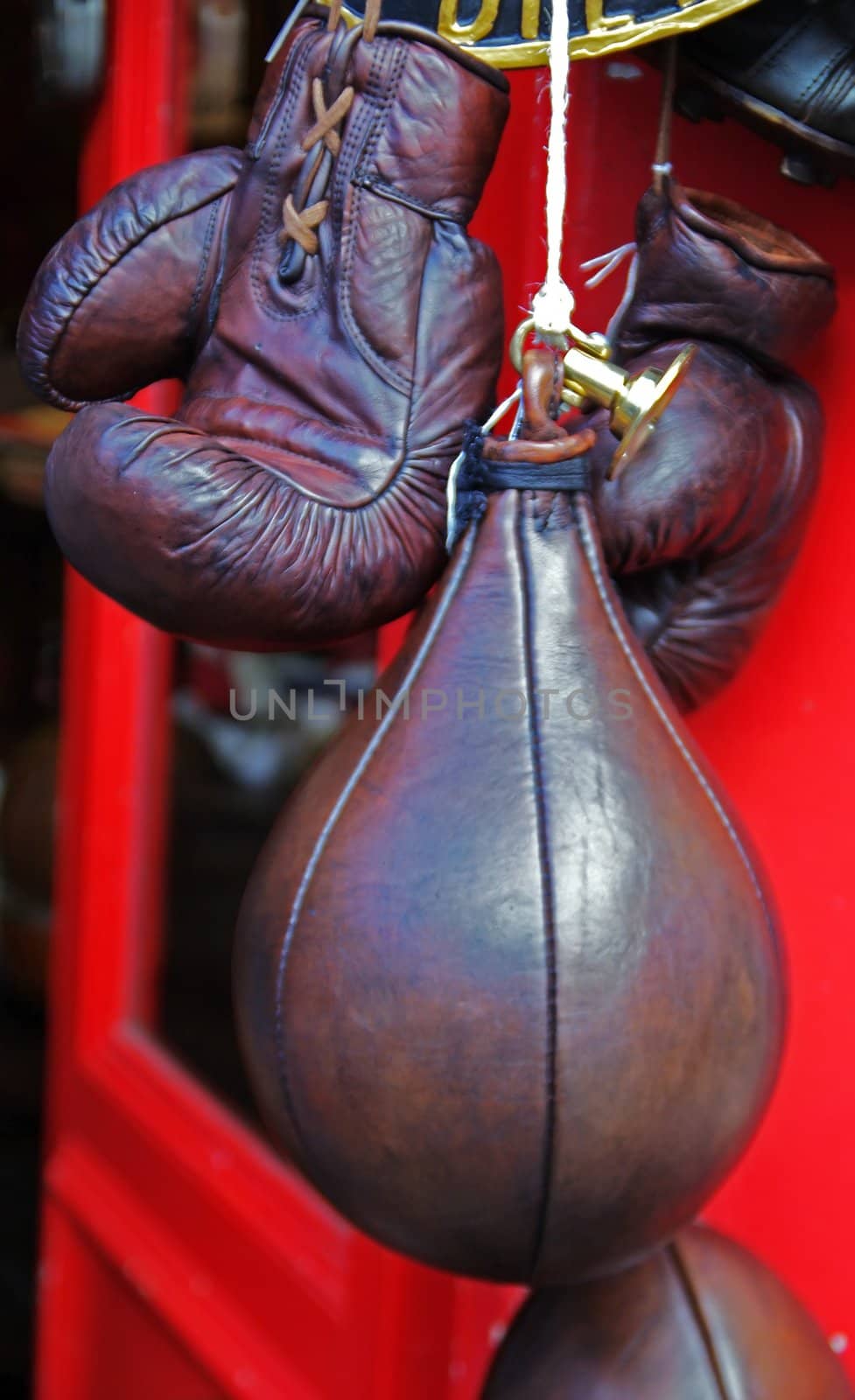 Leather boxing  ball and a pair of used boxing gloves