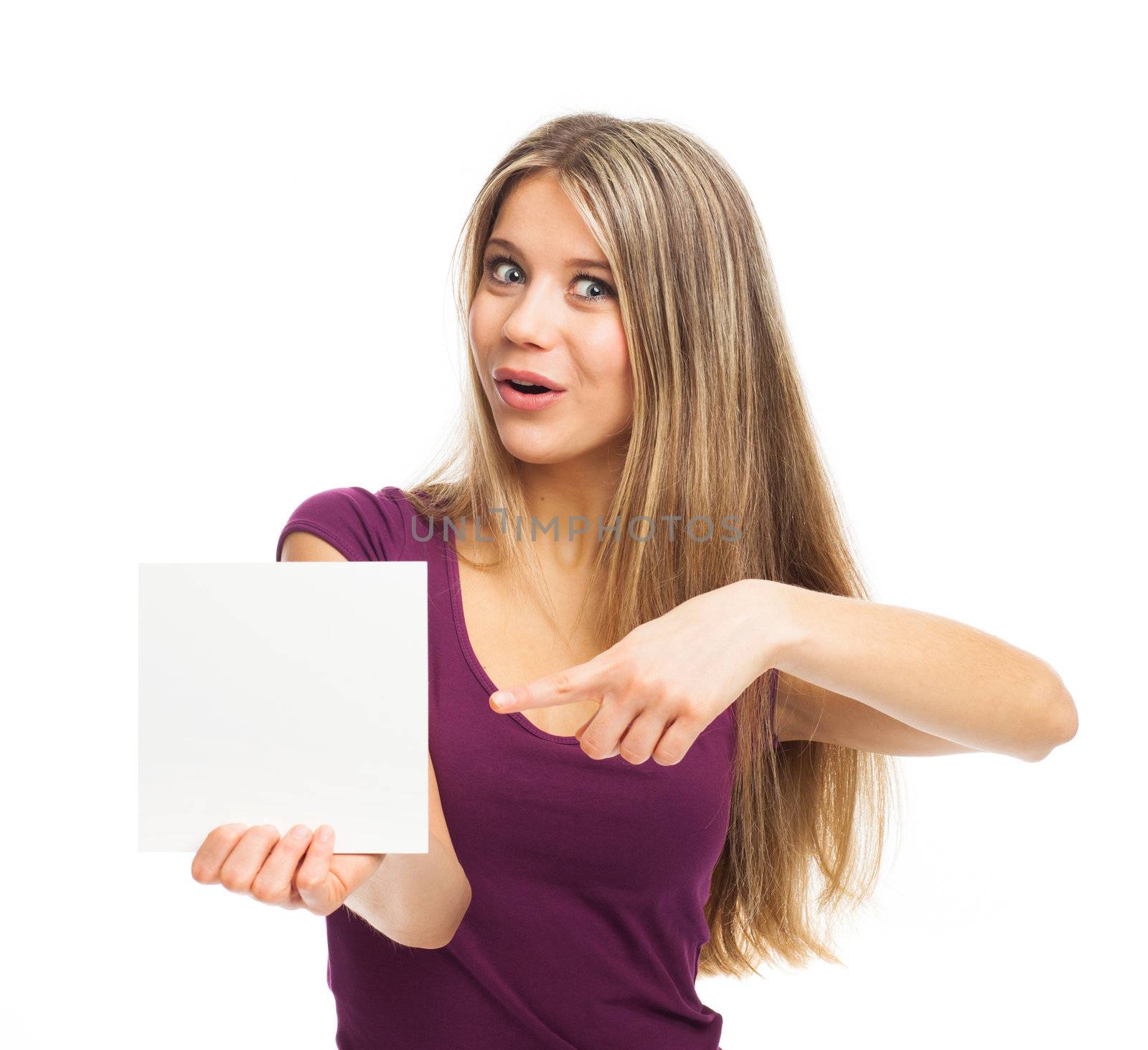 Pretty and cheerful young woman showing a white card, on white