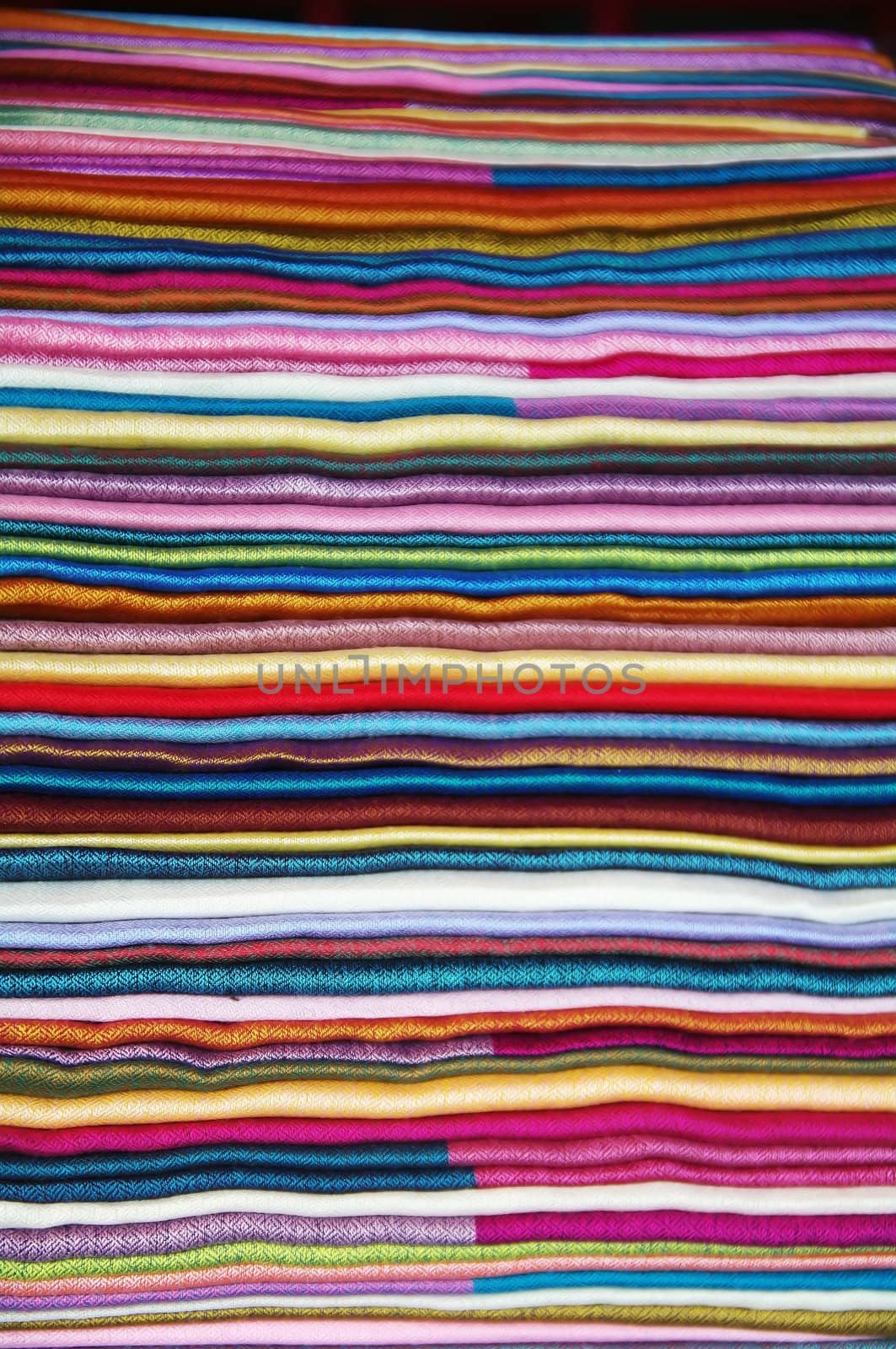 Number of colorful scarves put in a pile