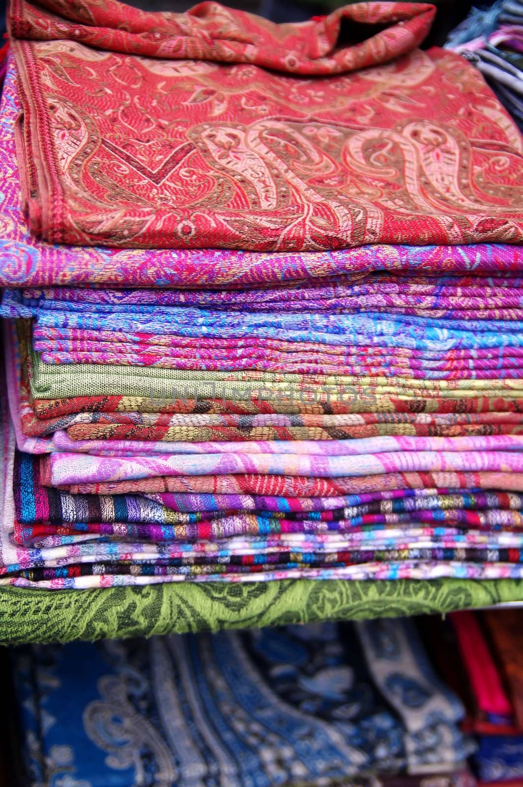 Number of colorful scarves put in a pile