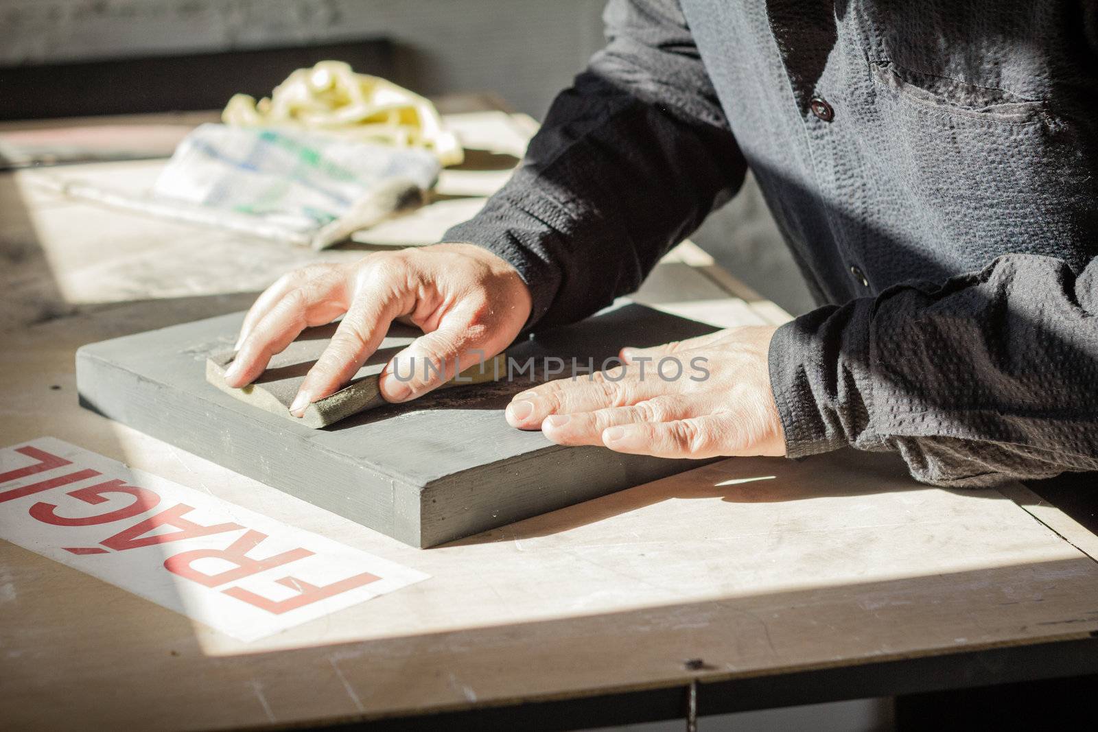 Painter artist working with hands on a oil canvas texture