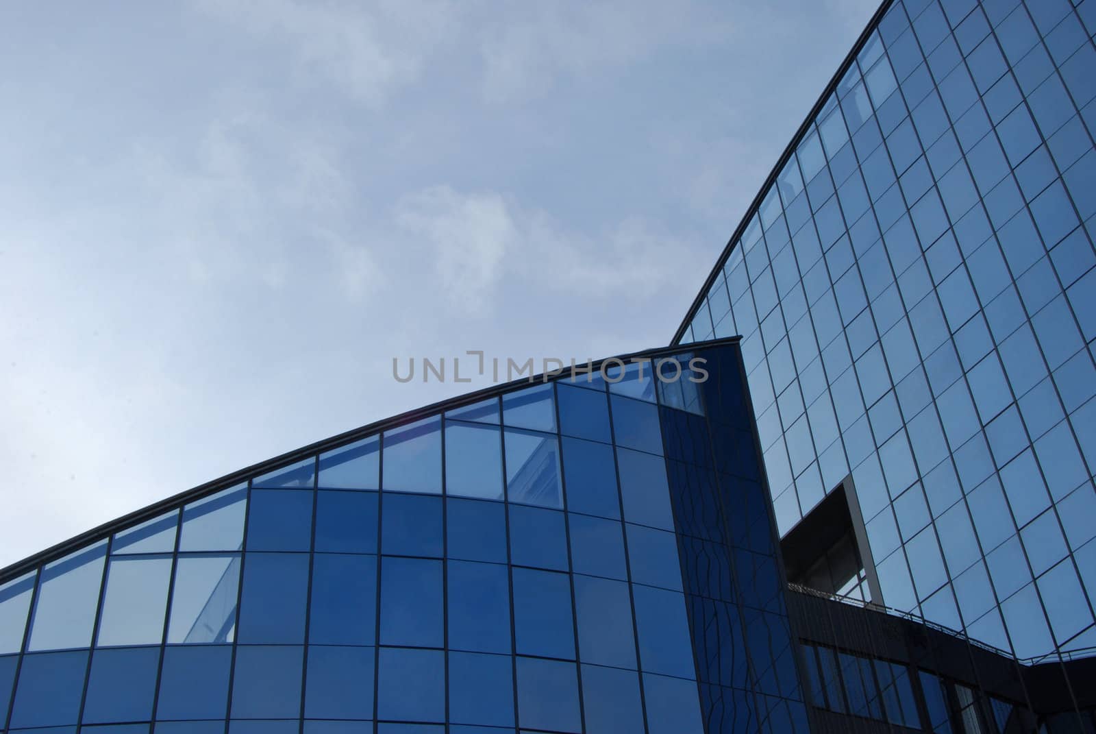 Modern business blue glass building top and sky