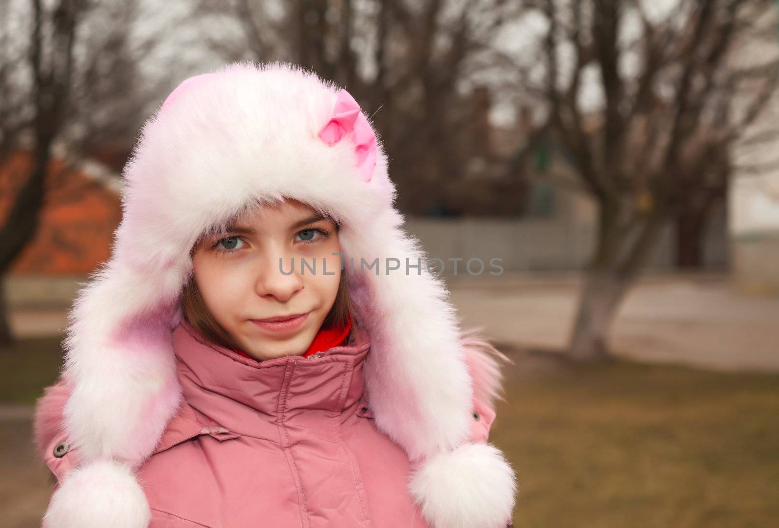 Teen girl staying outdoors at winter time