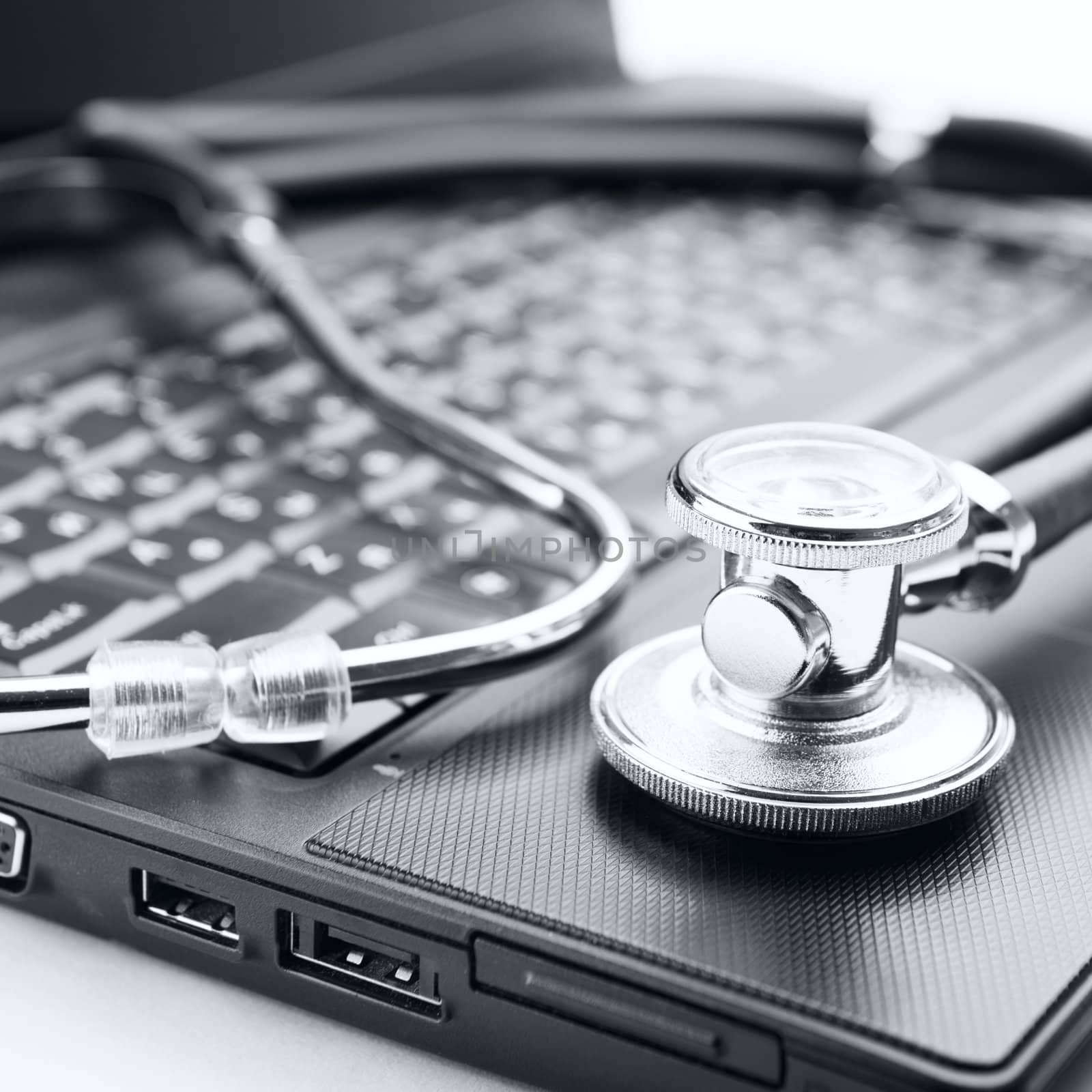 Concept of diagnostic. Stethoscope and laptop