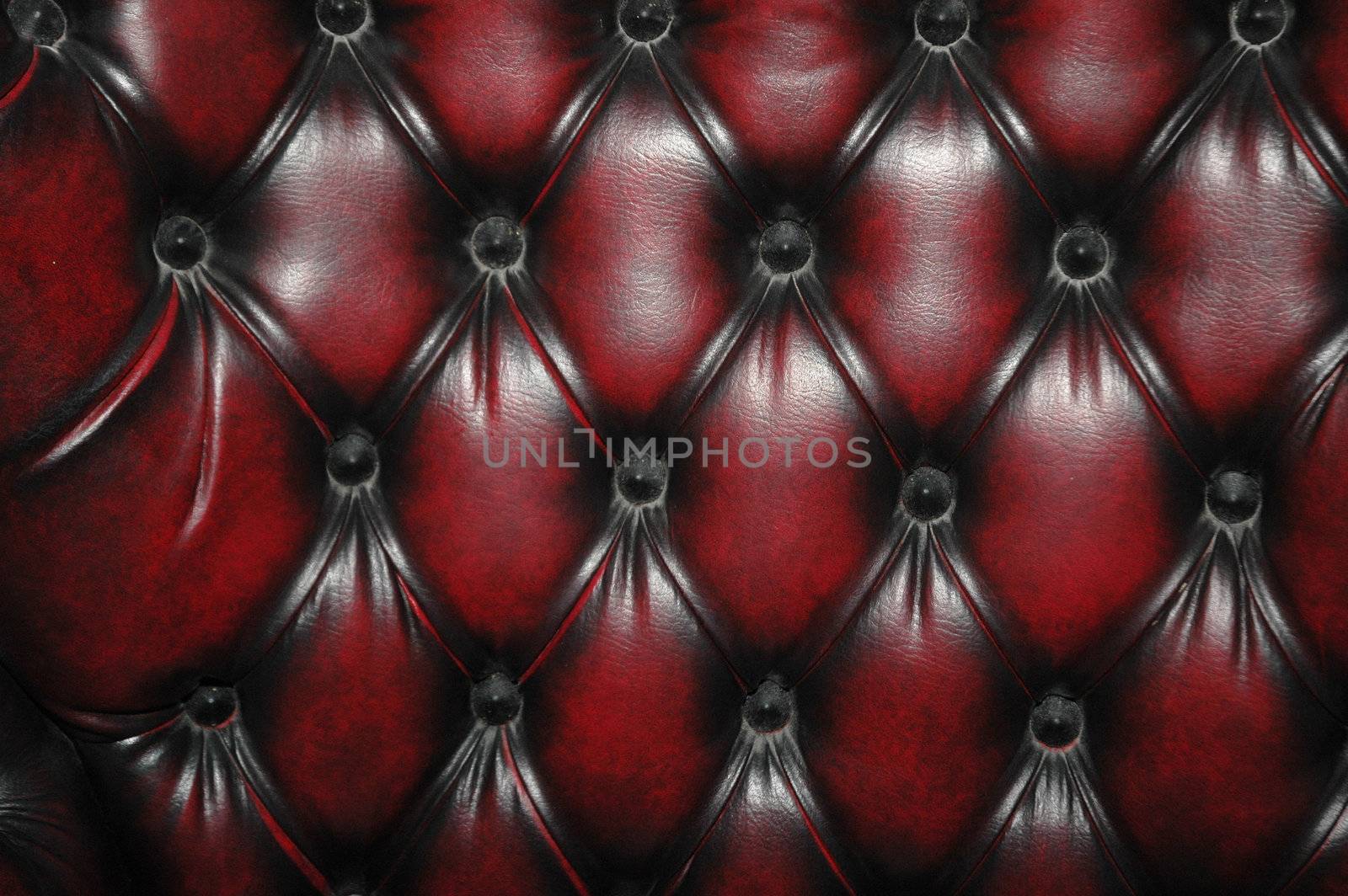 texture and pattern of red dark leather seat upholstery