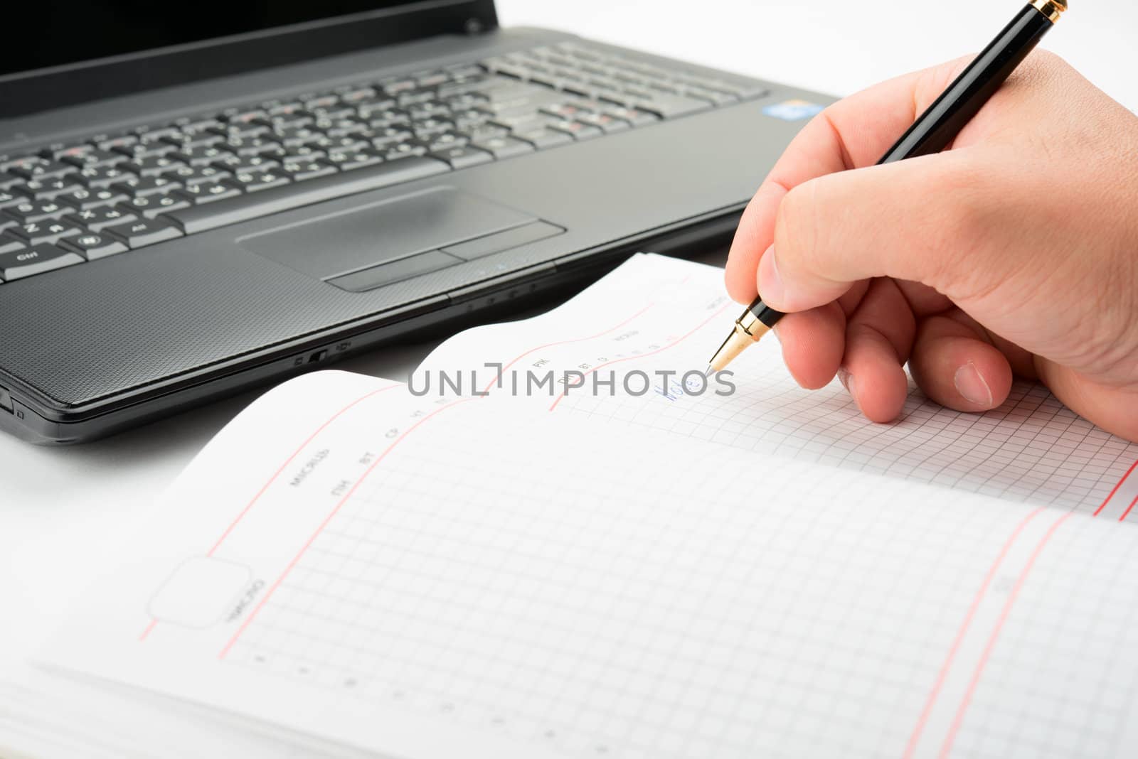 Businessman taking notes and planning in a meeting