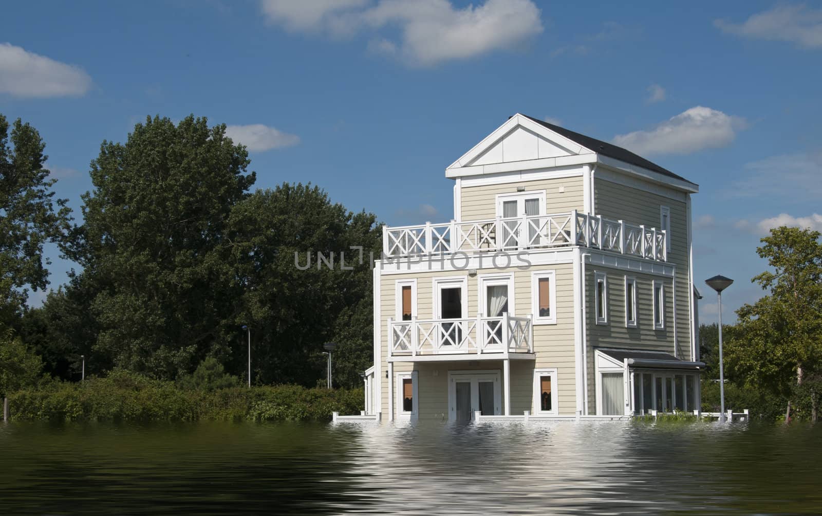 big wooden house with blue sky and white clouds in high water