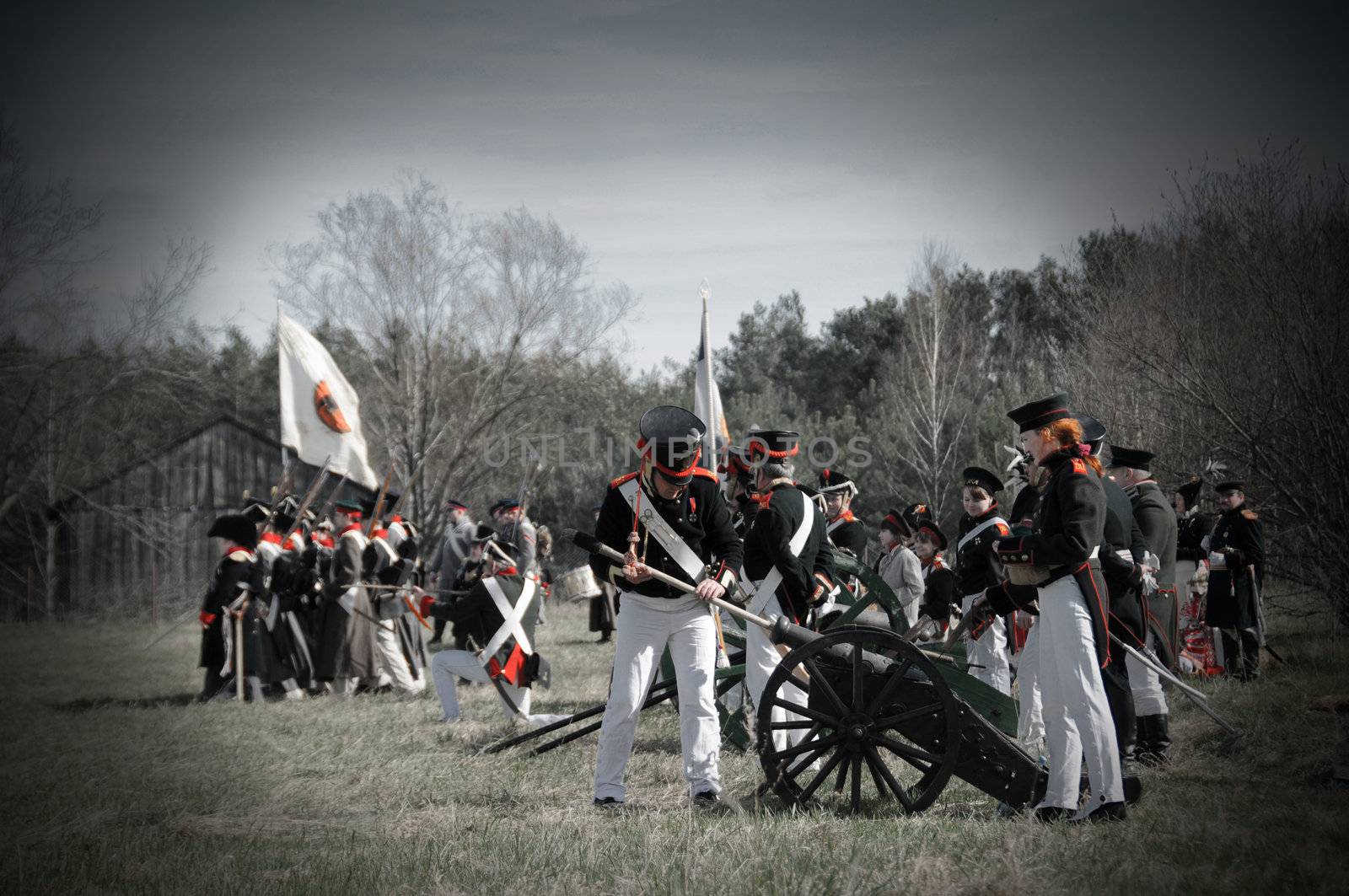 IGANIE, POLAND - APRIL 16: Members of Historic Artillery Group load a cannon at Battle of Iganie (1831) reenacted on a battlefield on 180th anniversary on April 16, 2011 in Iganie, Poland