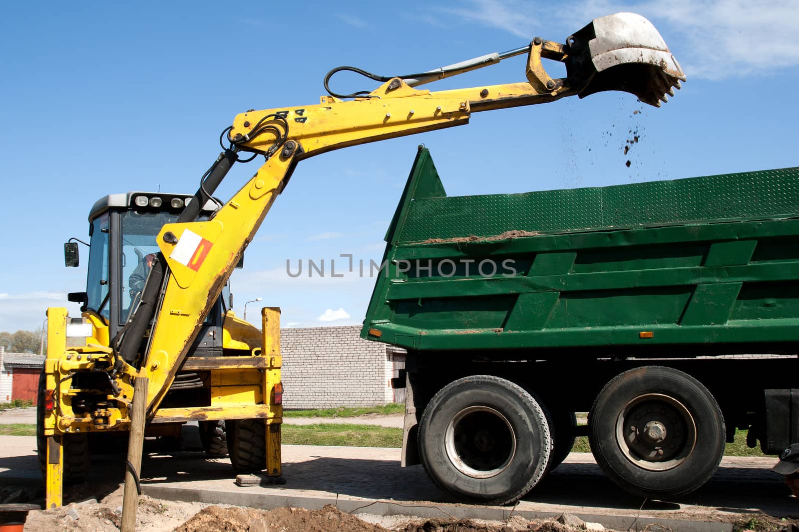 Excavator bucket with sand