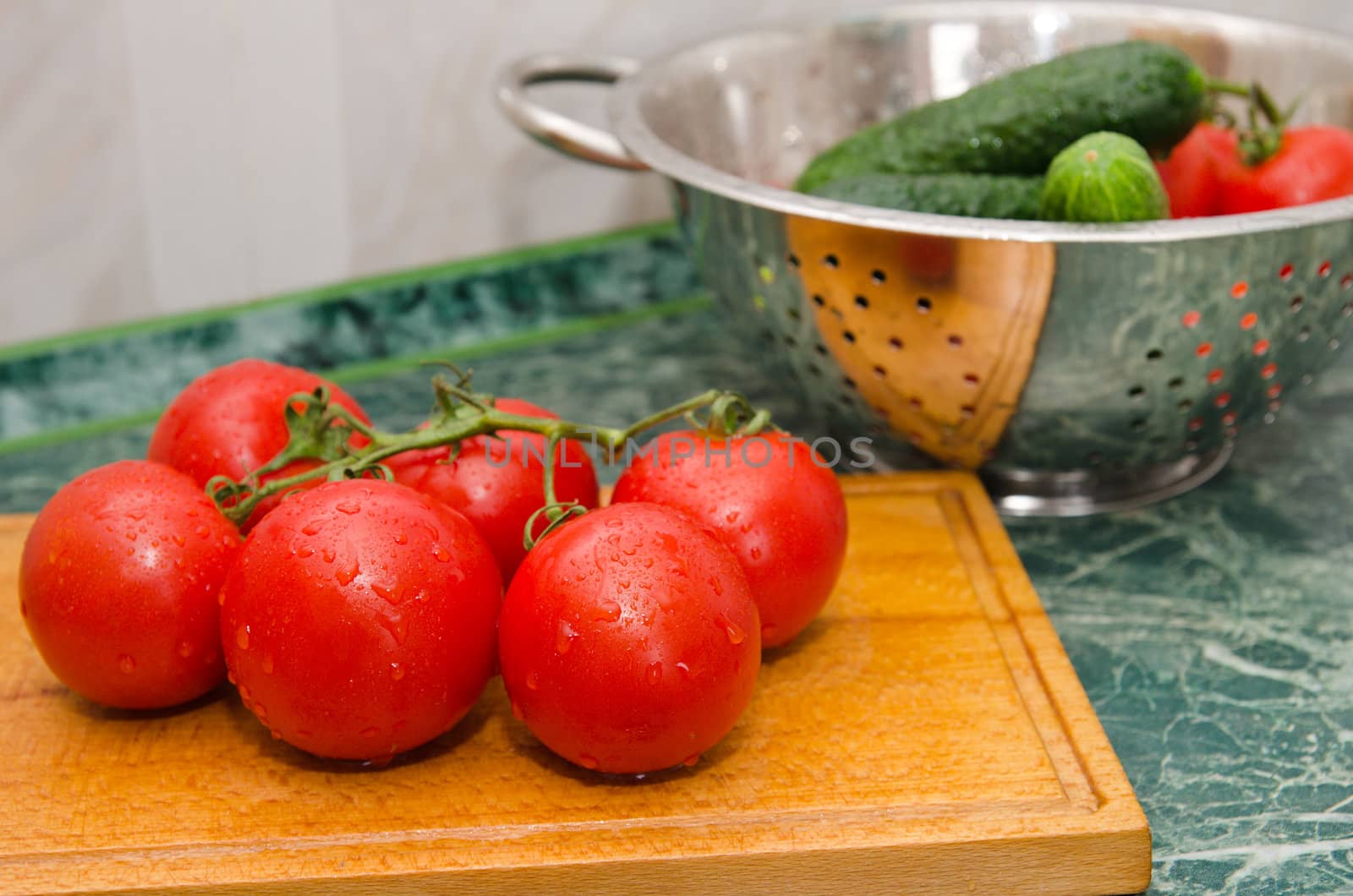 red tomato and green cucumbers