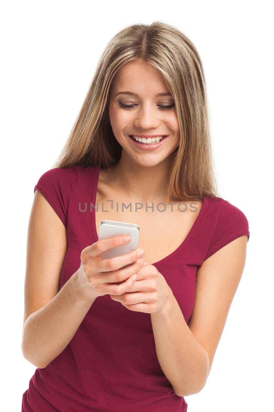 Girl writing or receiving a message on her phone, on white