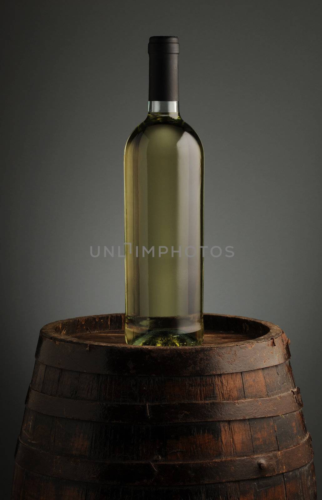 wine bottle on wodden barrel