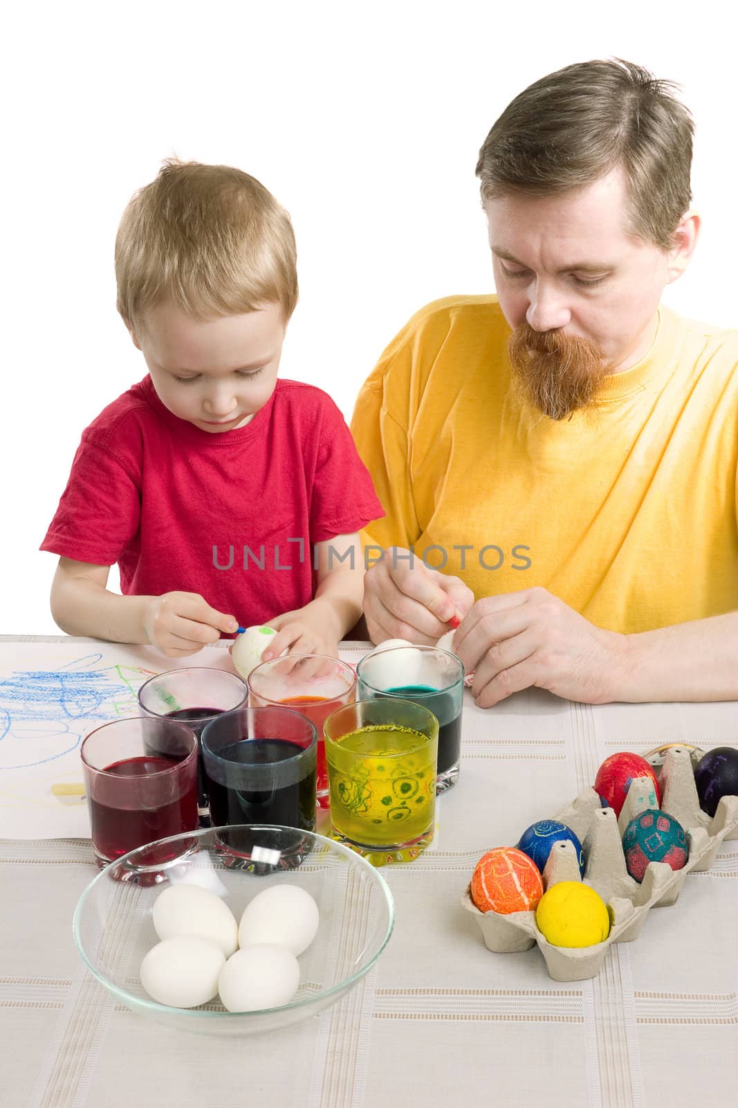 The man and the boy draw Easter eggs 