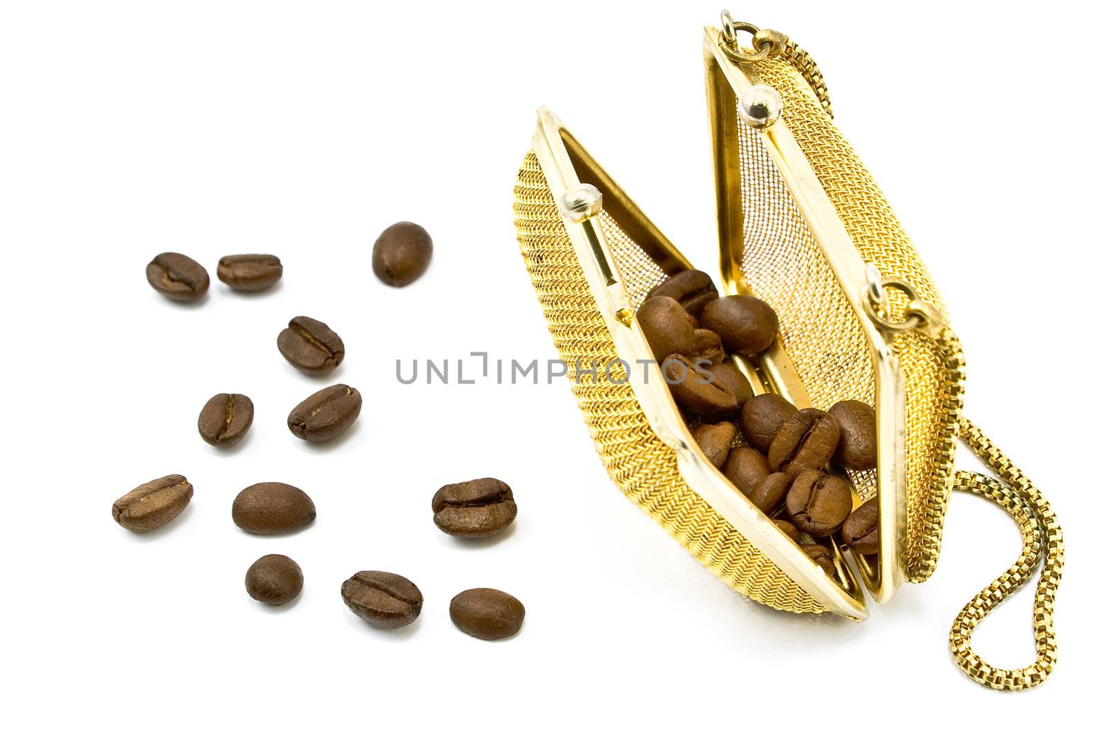 Gold  metallic purse with coffee beans isolated on white