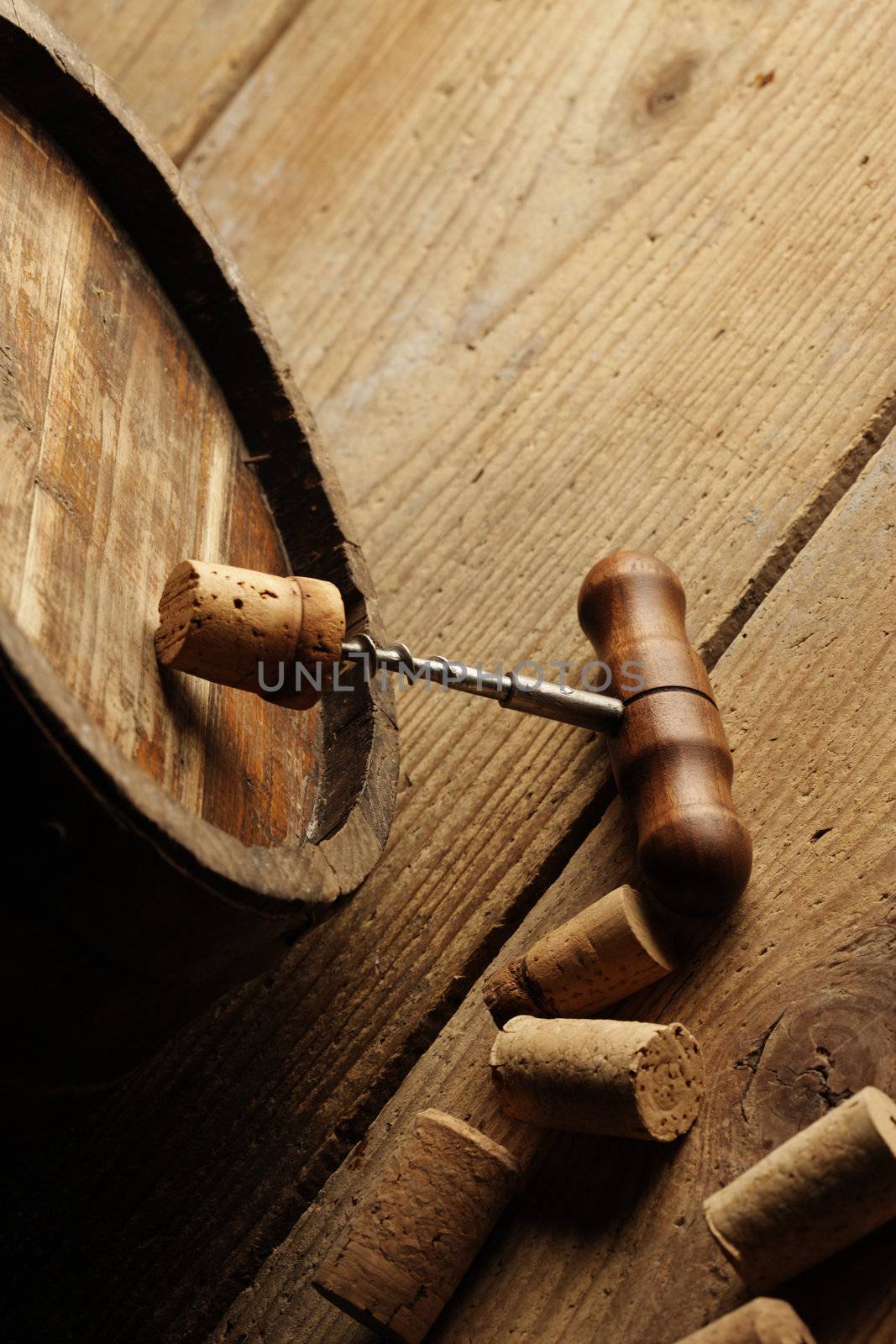 corkscrew and wooden barrel