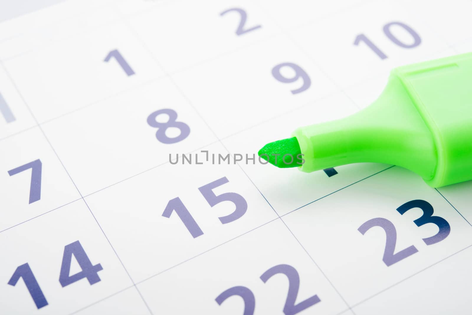 Green marker and open calendar